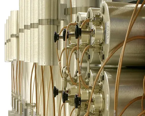 Shiny metal cylinders in row