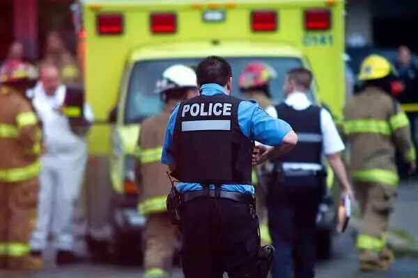 Police officer wears black vest