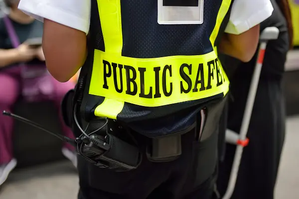 Yellow public safety vest prominently shown