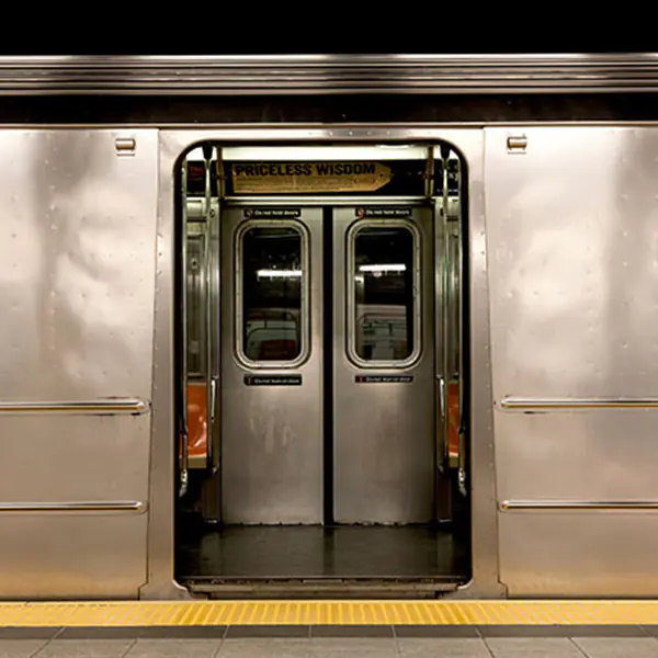 Stainless steel subway doors open wide
